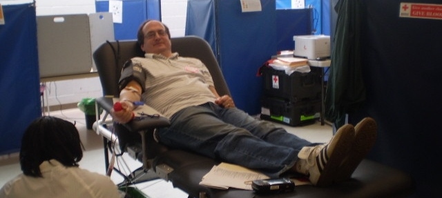 Khalid Asad of Frederick, MD donating blood at the fair